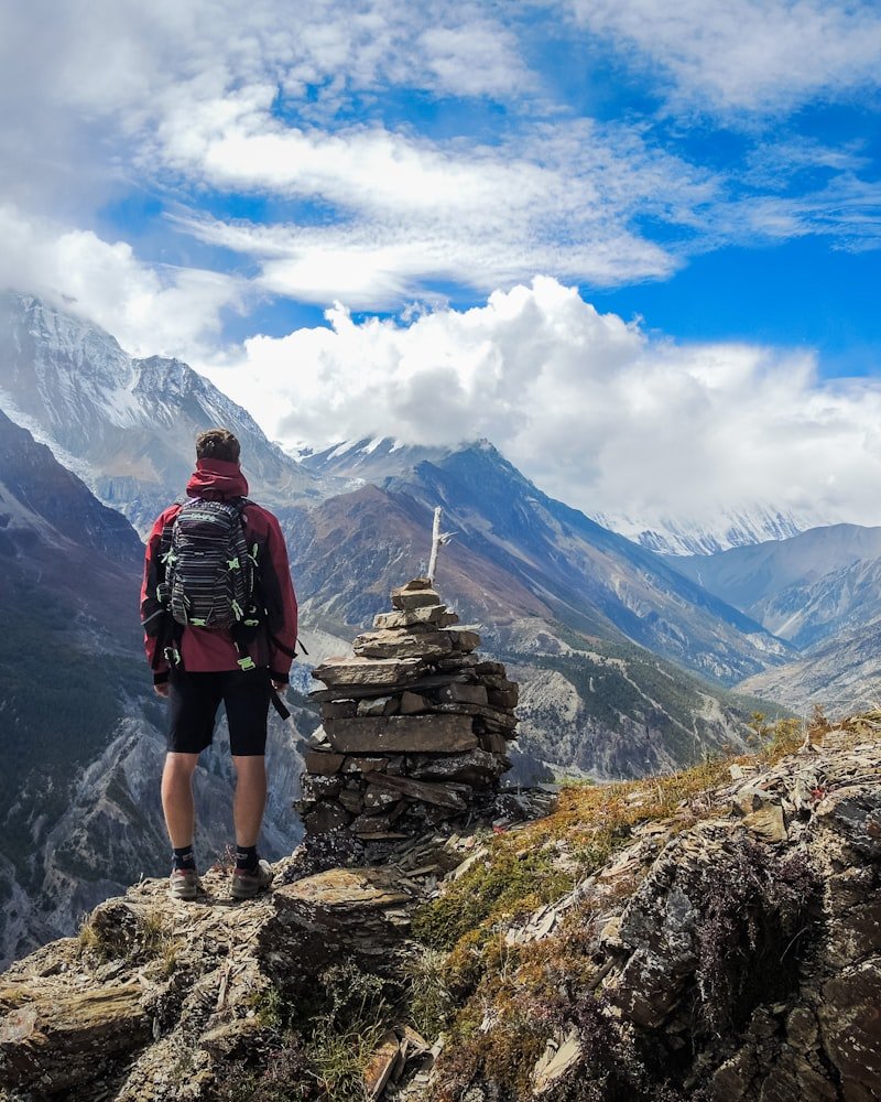 Prayer flags and a stupa against a Himalayan sky