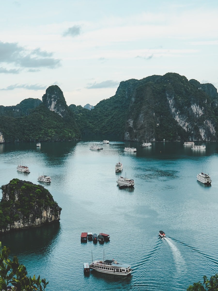 Traditional junk boats among limestone karsts in Halong Bay, Vietnam